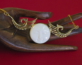 Deco Moon Goddess Necklace ~ Hand carved bone set in gold-tone brass on 18" chain, lobster claw clasp, serene face and art deco wings