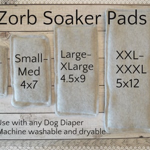 May include: Four beige absorbent pads for dogs, labeled with sizes and dimensions in inches: XXS-XS 3x5, Small-Med 4x7, Large-XLarge 4.5x9, XXL-XXXL 5x12. Text below reads: Use with any Dog Diaper Machine washable and dryable.
