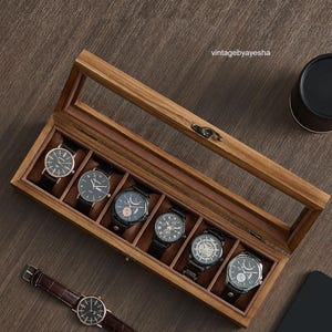 May include: A set of three ceramic mugs with a speckled, matte finish. The mugs are in shades of cream, light gray, and dark gray. Each mug has a simple, minimalist design, perfect for coffee or tea.