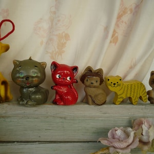 various,small,animal,mostly cat figures,ornaments.wax candle,flock,wood,ceramic pepper holder.