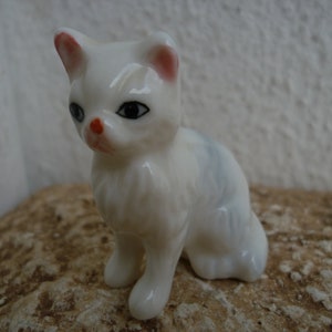 vintage,white,glazed,ceramic,cat with blue tint & pink ears,painted features,small kitten,long haired.