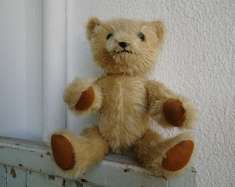 vintage,12'' fully jointed,teddy bear,worn,threadbare with bald patches.