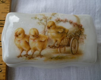 small,glazed ceramic,oblong,apothecary pot with lid,whiteporcelain with Victorian chicks & egg design on lid