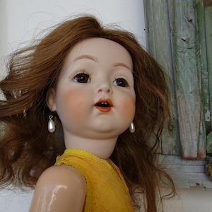 24&#39;&#39; repro Simon & Halbig doll,bisque head,compo body,open mouth with teeth,pierced ears.