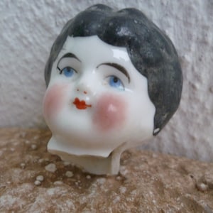 broken,glazed,Antique,China doll head,part,flawed,Thuringia,German doll fragment.