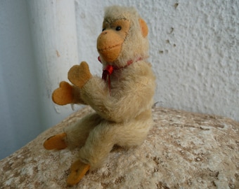 vintage,small,4 1/2'' Steiff,white mohair,sitting Jocko,fully jointed,chimpanzee,monkey,silverscript button.