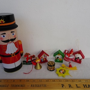 lot of 9,Vintage,German,larger erzgebirge,painted wooden,Christmas tree decorations in nutcracker tin box.