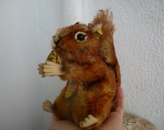 vintage,Steiff,17 cm.Perri squirrel with nut,Copyright Walt Disney,silverscript button,ear label & chest tag present.4317/03