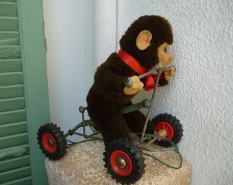 vintage,plush monkey,chimp on wheels,German pull along toy.