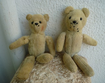two,antique,sml,very primitive,handmade,teddy bears,straw filled,falling apart.