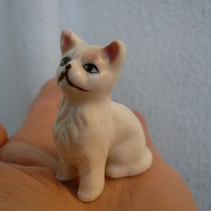 vintage,white,glazed,ceramic,cat with pink,tinted ears,painted features,small kitten,long haired.