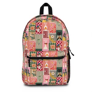 May include: A pink backpack with a whimsical patchwork design. The pattern includes cartoon cats, ducks, and frogs wearing sunglasses, along with floral and checkerboard elements. The text "CHILL WHAT THE" is also visible.