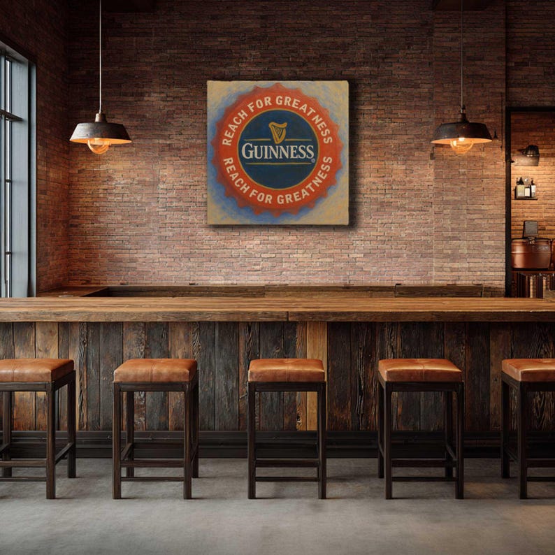 Op de afbeelding: Een pubsfeer met een Guinness-bord met de tekst "Reach for Greatness". Het bord hangt boven een houten bar met leren krukken. De bakstenen muur en hanglampen cre&euml;ren een warme, uitnodigende sfeer.