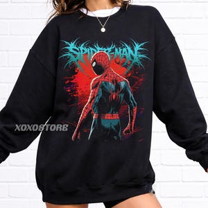 May include: A white ceramic mug with a black handle and the text "But First, Coffee" in a black, bold font. The mug is on a white surface.