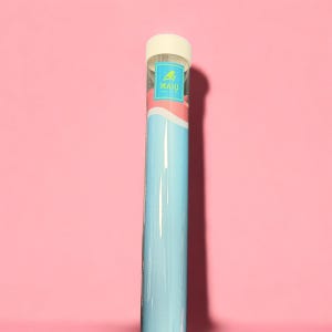 May include: A cylindrical storage tube with a light blue exterior and a white cap. The tube features a rectangular label near the top with a yellow bird icon and the text MAHJ printed in yellow. The design includes a curved white accent line.