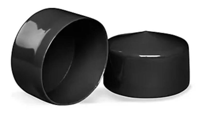 May include: Two cylindrical black end caps with a smooth, glossy finish. One cap is positioned upright to show its flat top surface, while the other is tilted on its side to reveal the hollow interior and the circular opening of the component.