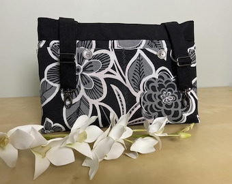 Powerchair bag, wheelchair purse, walker organizer, wheelchair accessory:  Black, white and gray floral print bag with gray lining.