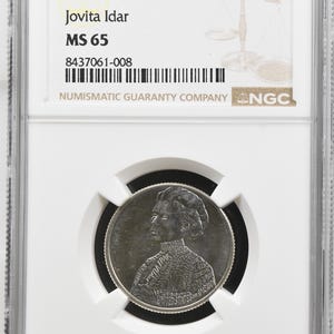 May include: A 2023 P Jovita Idar quarter coin graded MS 65 by NGC, encased in a clear rectangular plastic slab. The coin features a portrait of Jovita Idar with text integrated into the design, including United States of America and her name.
