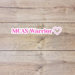 May include: A rustic wooden sign with the text "Welcome to our home" in white lettering. The sign has a distressed finish and a simple, inviting design, ideal for entryway decor.