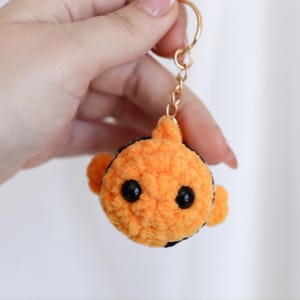 May include: A set of three ceramic mugs with a speckled, matte finish. The mugs are in shades of cream, light gray, and dark gray. Each mug has a simple, minimalist design, perfect for coffee or tea.