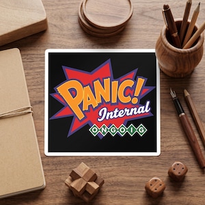 May include: A square sticker featuring a black background with a red and purple comic-style starburst graphic. The text reads PANIC! in large orange letters, Internal in white script, and ONGOIG in white letters inside five green diamonds.