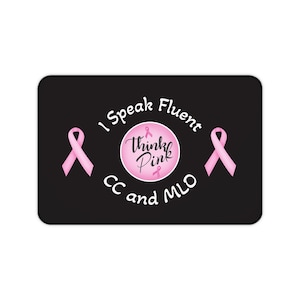 May include: Black rectangular mousepad with the text "I Speak Fluent CC and MLO" in white. The mousepad features two pink ribbons and a central circle with the words "Think Pink" and a pink ribbon.