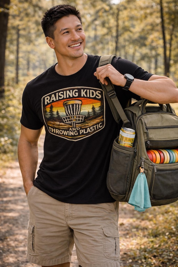 Raising Kids and Throwing Plastic Shirt, Disc Golf Dad Shirt, Funny Disc Golf Tee, Disc Golfer Gift, Fathers Day Disc Golf Shirt