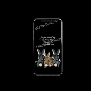 May include: A smartphone displaying a black background with a watercolor illustration of four rabbits viewed from behind. The text reads: As for me and my house, We will serve the Lord, Joshua 24:15. The rabbits are in shades of black, brown, and tan.