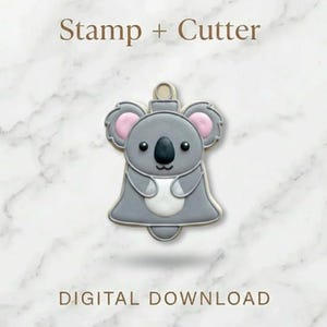 May include: A gray koala cookie cutter and stamp set. The koala has pink ears, a black nose, and a white belly. The text "Stamp + Cutter" is above the koala, and "DIGITAL DOWNLOAD" is below.