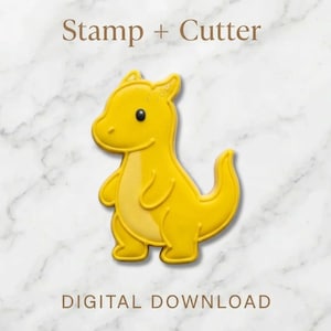 May include: A set of three ceramic nesting bowls in graduating sizes. The bowls feature a speckled, matte finish in shades of cream, light gray, and dark gray. Each bowl has a rounded shape and a slightly flared rim.