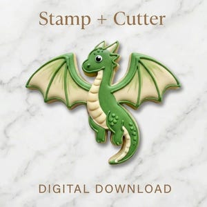 May include: A green dragon cookie cutter and stamp set. The dragon has green wings and body with a cream-colored belly. The text "Stamp + Cutter" and "DIGITAL DOWNLOAD" are displayed above and below the dragon.