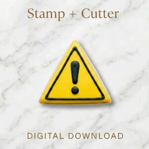 May include: A yellow triangle-shaped cookie cutter and stamp with a black exclamation point. The words "Stamp + Cutter" and "DIGITAL DOWNLOAD" are printed above and below the cookie cutter on a marble background.