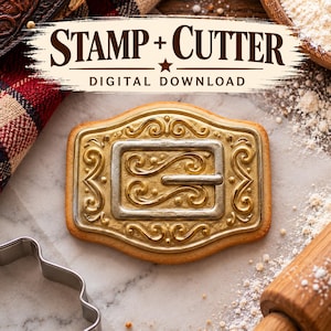 Könnte beinhalten: Ein rechteckiger Keks mit einem gold- und silberfarbenen Gürtelschnallen-Design mit komplexen Schnörkeln. Der Text STAMP + CUTTER DIGITAL DOWNLOAD steht über dem Keks. Der Keks hat einen hellbraunen Rand und eine detaillierte Prägung.