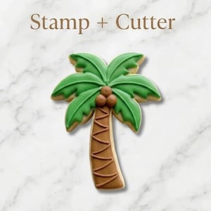 May include: A palm tree cookie cutter and stamp set. The palm tree has green leaves, brown trunk, and three brown coconuts. The text "Stamp + Cutter" is at the top.