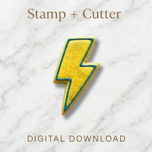 May include: A yellow lightning bolt cookie cutter and stamp set with blue trim, on a marble background. The text "Stamp + Cutter" and "DIGITAL DOWNLOAD" are displayed above and below the cookie cutter.
