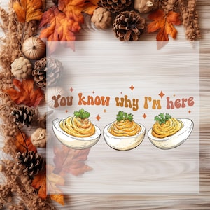 May include: A handmade wooden sign with the text "Welcome to our home" in a handwritten style. The sign is painted white with a dark stained wooden frame. A small, decorative heart is attached to the bottom.