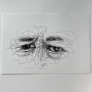 May include: An abstract black and white drawing of eyes and eyebrows, created with a series of scribbled lines. The artwork is on a white rectangular card, with the eyes suggesting a mood of sadness or introspection.