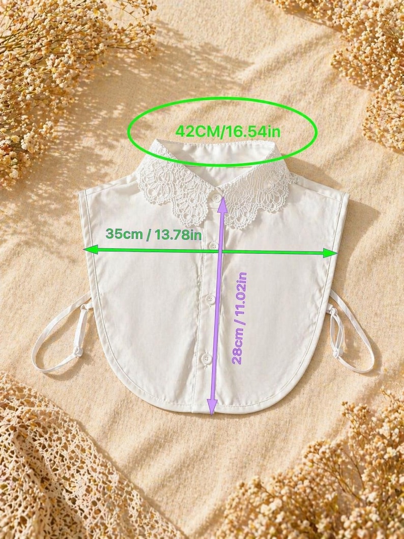 May include: A white detachable collar with a lace trim, measuring 16.54 inches across the top, 13.78 inches wide, and 11.02 inches long. The collar has a button-down front and tie closures.