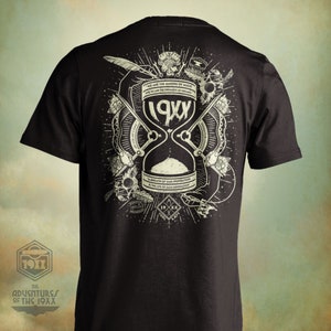 May include: Black t-shirt with a white graphic design featuring an hourglass with the text "19XX" and the words "We are the makers of music and we are the dreamers of dreams. A breath of our inspiration is the life of each generation."