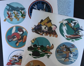 May include: A set of nine round stickers featuring various cartoon characters from Disney, including Donald Duck, Pluto, and Goofy. The stickers are printed on white paper and feature a variety of colorful designs. The stickers are part of a series called "World War II Animators Do Their Part Insignia Art".