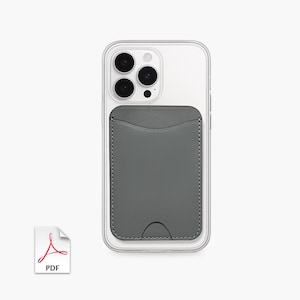 May include: A clear phone case with a gray leather card holder attached. The card holder is stitched around the edges and has a curved bottom. A PDF icon is in the lower left corner.