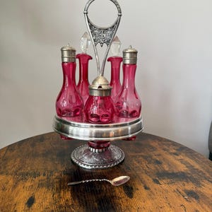 Pristine Antique Victorian Cranberry Glass Cruet set | Wm. A. Rogers Pattern 57