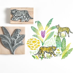 Timbres en caoutchouc de tigre et de léopard avec des feuilles de jungle