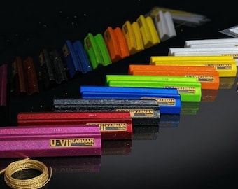 May include: A set of three ceramic mugs with a speckled, matte finish. The mugs are in shades of cream, light gray, and dark gray. Each mug has a simple, minimalist design and a rounded handle.