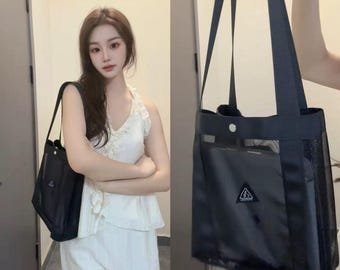 Nuevo bolso de playa negro para mujer, bolso organizador de malla de lujo portátil de gran capacidad para viajes, elegante bolso de mano para exteriores y neceser de maquillaje.