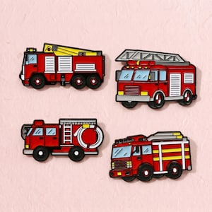 May include: Four enamel pins shaped like red fire trucks. Each pin features distinct details including yellow ladders, white side panels, blue-tinted windows, black wheels, and coiled white hoses, all rendered in a flat, graphic illustration style.