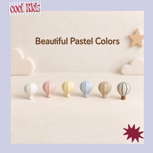 May include: Six drawer knobs shaped like hot air balloons in various pastel colours including white, pink, yellow, light blue, beige, and a striped blue and beige pattern. The text cool Kids and Beautiful Pastel Colors is visible.