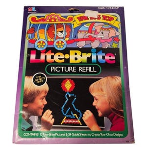 May include: A vintage Lite-Brite Picture Refill box featuring a circus theme with a lion, elephant, and the words "The Big Top." The box includes the text "Ages: 4 and Up" and "For Lite-Brite Only."