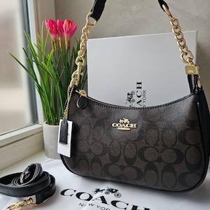 Bolsa de ombro Teri — Lona exclusiva com detalhes em preto e marrom