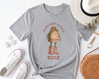 Humorous Cowboy Frog Graphic Tee, "Diddly Squat" Quote Print Heather Gray Western Casual Crew Neck，Cowboy Frog "Diddly Squat" Casual Tee